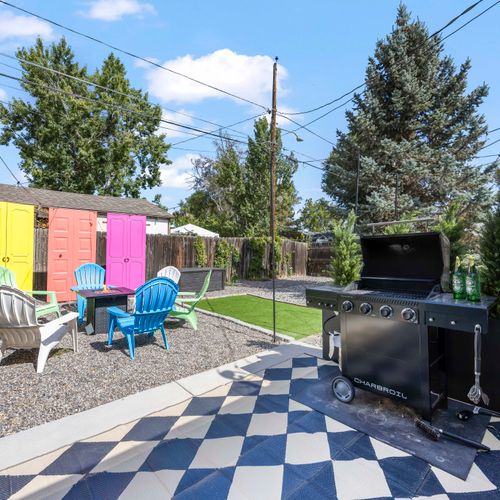Spacious backyard with bbq grill, fun perks, and room to relax outdoors.