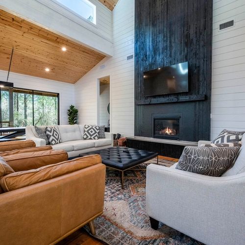 The floor to ceiling gas fireplace.