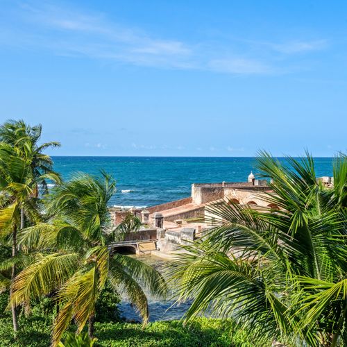 Immerse yourself in the beauty of the coastline, featuring swaying palm trees, crystal-clear waters, and the iconic architecture of the historic fort.