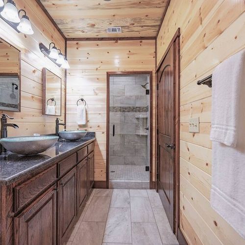 The full bathroom comes with double vanity and a walk-in shower.