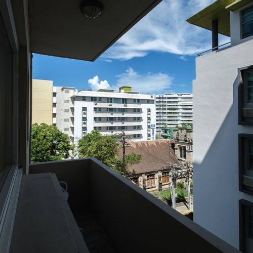 Step out onto the private balcony and take in a charming view of the vibrant neighborhood. It’s an excellent spot for a quiet moment or an evening breeze.