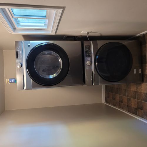 Laundry room:  next to the back door is a very convenient stacked washer and dryer.