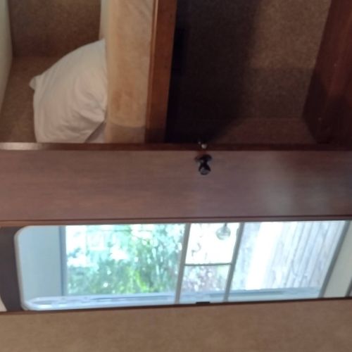 Bedroom #2:  includes 3 twin beds, a dresser, and a television.
