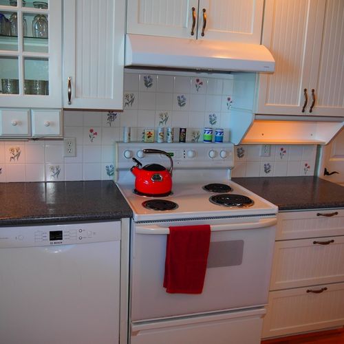 Kitchen:  the home has a large, beautiful, and very functional kitchen with all appliances including a dishwasher. There is a good supply of cooking and dining utensils included as well.