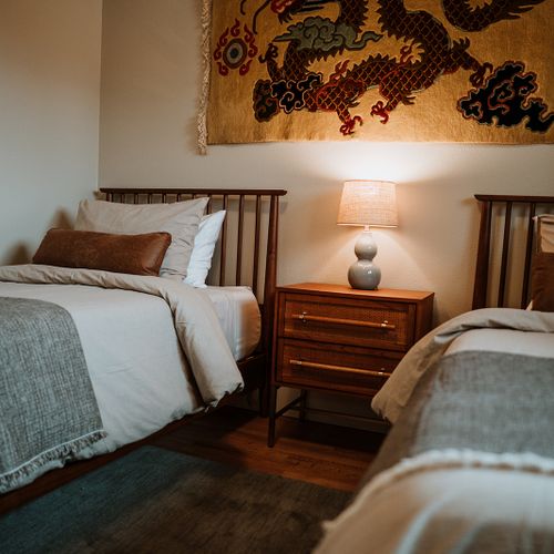 Double the comfort, double the charm! Our upstairs twin bedroom is perfect for pillow talk and a cozy night's rest.