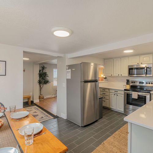 - set the table for a home cooked dinner or quick bite in this casual dining area
- stainless appliances and classic cabinetry make cooking easy and enjoyable
- seamless flow from kitchen to living area makes hosting or relaxing effortless