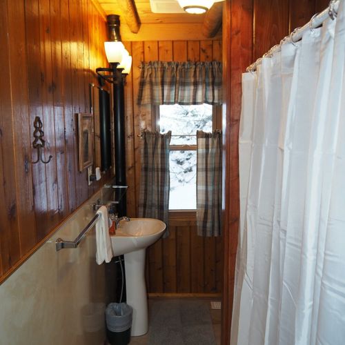 Bathroom (main floor):  the cabin has a full bathroom on the main floor with a combination tub / shower.