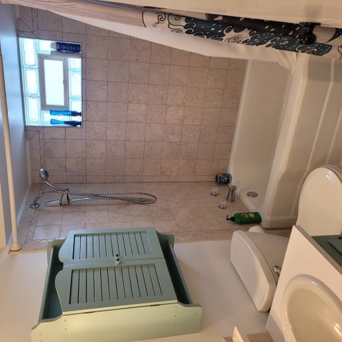 Bathroom #1:  full bathroom with a combination tub and shower.