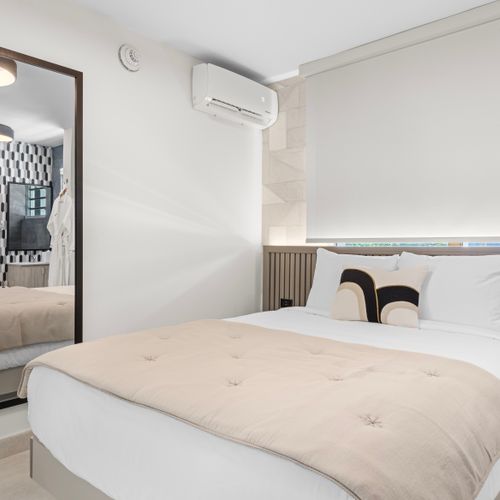 Indulge in ultimate comfort in this luxurious bedroom, showcasing a plush bed and elegant decor
