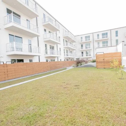 Well-kept exterior w/ lush lawn — a welcoming community setting.