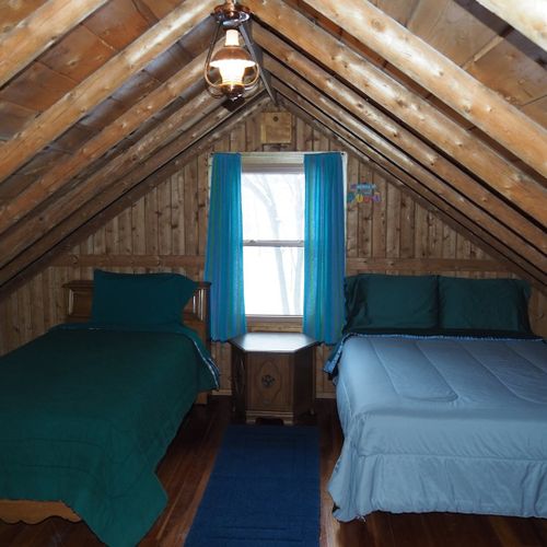Loft area:  there is a large upstairs loft with a full-size bed, a twin bed, and some older exercise equipment that is available for guests to use.