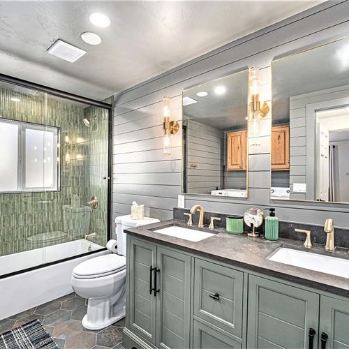 Enjoy the spacious main floor bathroom, featuring a double sink vanity and a convenient tub-shower combo.