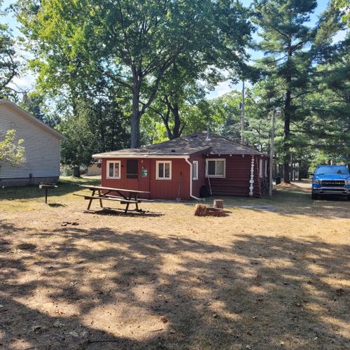 Exterior:  the large family-friendly backyard with picnic table, firepit, and charcoal grill