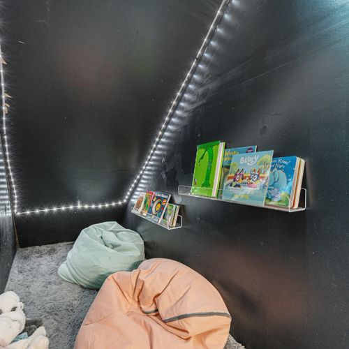 The kids corner cozy nook designed for imagination and quiet retreats into captivating stories.