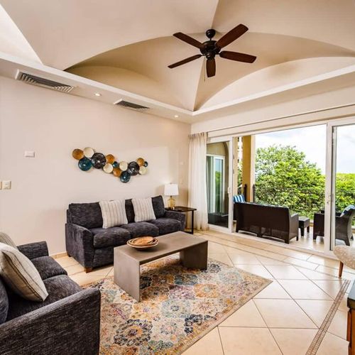 The living room has access to the outside balcony.