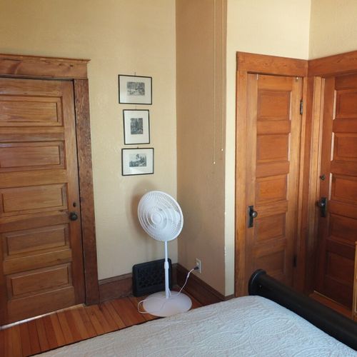 Bedroom #1 (first floor):  features a beautiful queen-size sleigh bed, nightstands, lamps, a ceiling fan with lights, dresser, chair, closet, and its own private entrance to the first floor bathroom.