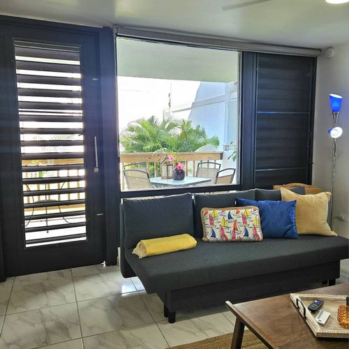 This inviting sofa offers a comfortable spot to kick back and relax. With easy access to natural light and a pleasant view, it's a versatile space for all your downtime needs.