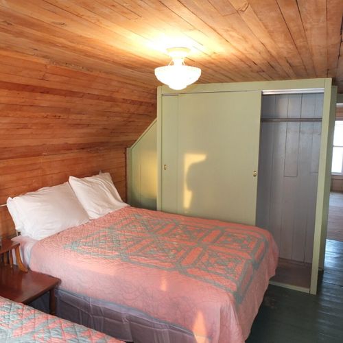 Bedroom #4 (second floor):  features 2 full-size beds, dresser, closet, and great views of crystal lake!