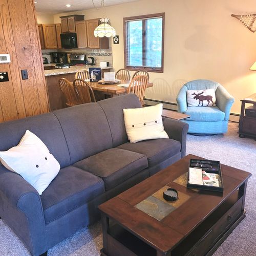 LIVING ROOM:  The large and beautiful living room with walk-out to the bonfire ring.  (Note that the fireplace is not available for guest usage.)