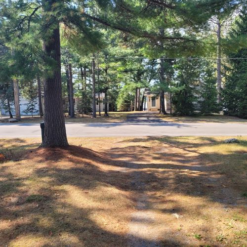 Exterior:  the driveway with van etten lake visible through the trees across the street.