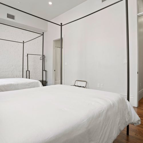 Large Master bedroom with en suite bathroom | Two queen beds