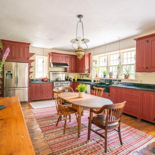 Chef's kitchen with eat in dining and stocked well stocked with cooking supplies.