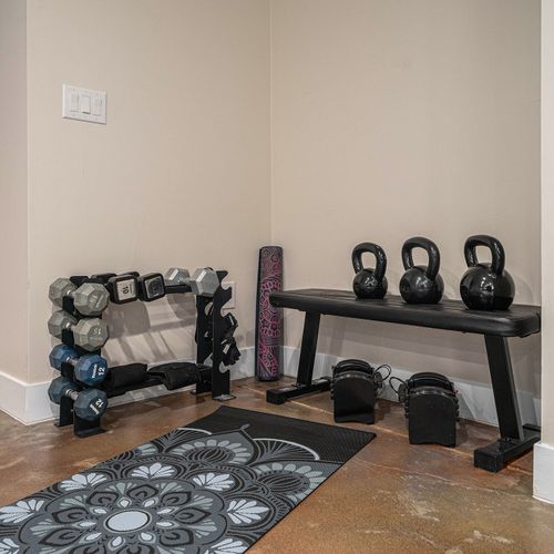Get your fitness on in our basement workout area!