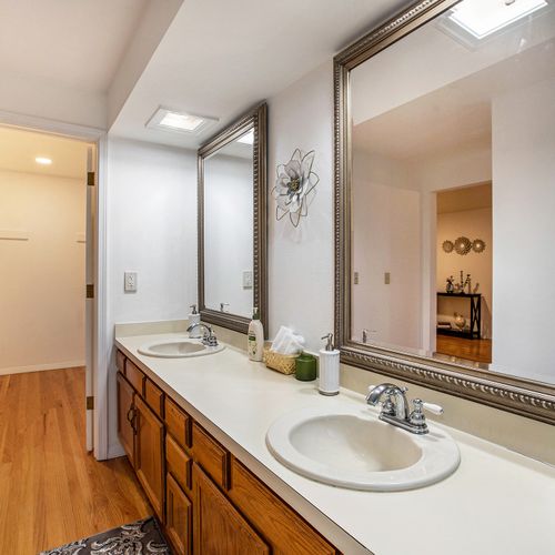 Enjoy the extra space with double vanity counters with extended countertops in the master bath.