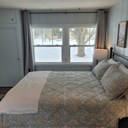 Bedroom #1:  bedroom #1 is the primary bedroom. It features a queen-size bed, ceiling fan, live streaming television, nightstands, lamps, a closet, a large dresser, a desk, and a comfy chair. There is also a door from the bedroom to the garage. (the door is fully lockable. )
