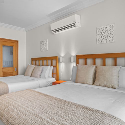 Your comfortable retreat: a beautifully decorated bedroom combining functionality with a breathtaking backdrop.