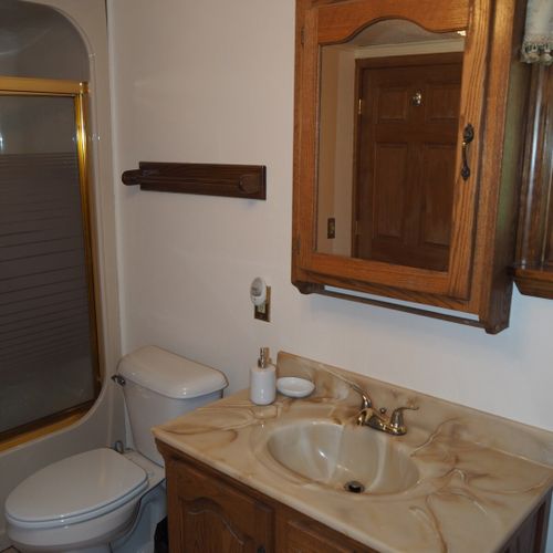 Bathroom #1:  full bathroom with a combination tub and shower. The washer and dryer are also in this bathroom.