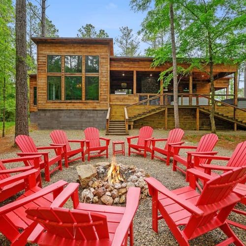 Enjoy the firepit at this modern luxury cabin.