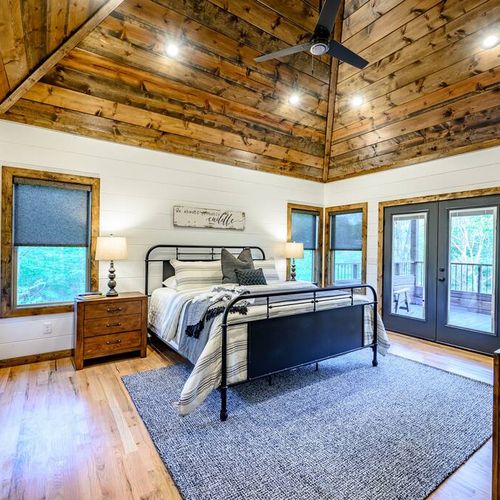 An upstairs King Suite has access to a private balcony overlooking the creek.
