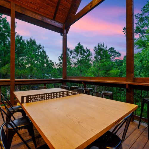 Outdoor dining table doubles as a ping pong table!