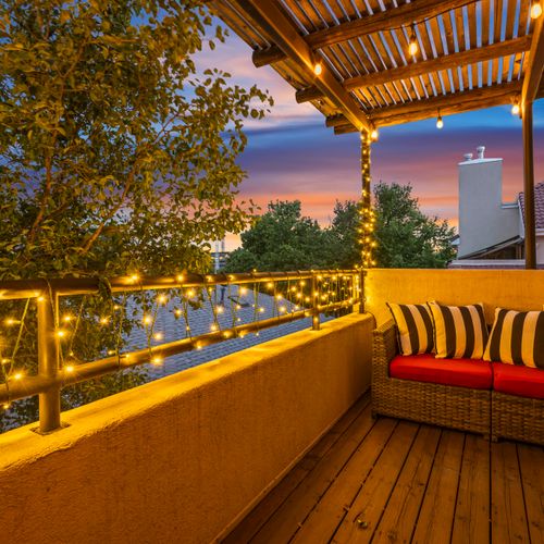 Enioy a private balcony off the primary suite.