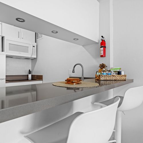 A bright and inviting kitchen space featuring modern amenities perfect for your morning brew.