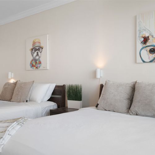 Wake up to inspiring ocean views! This room features comfortable beds and a playful, inviting atmosphere.