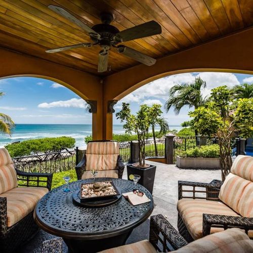 Enjoy sunset cocktails on the covered patio in super comfy chairs
