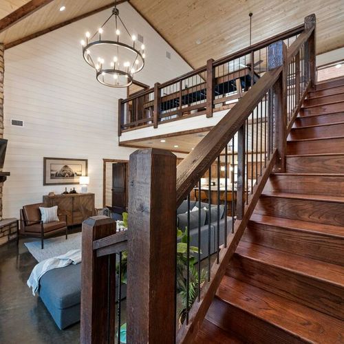 Upstairs leads to the loft and additional bedrooms.