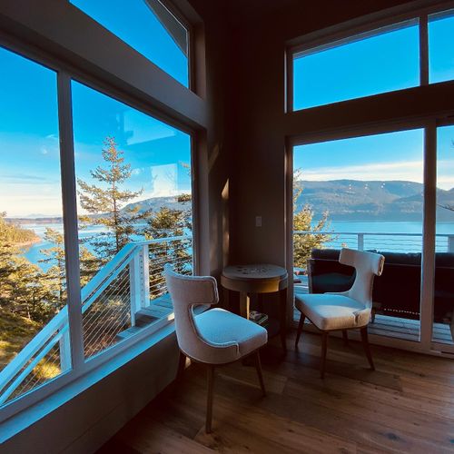 Water views with a puzzle table and outdoor seating.