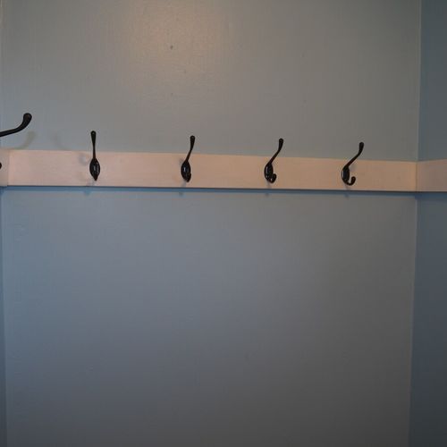 Foyer:  front foyer includes a mirror, open closet, and lots of hooks for hanging clothes.