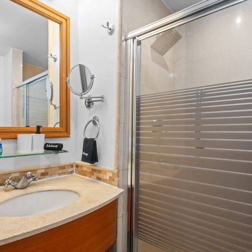 Your private spa moment. Step into this inviting shower space, designed for comfort and ease, offering a clean and modern environment for your personal care.