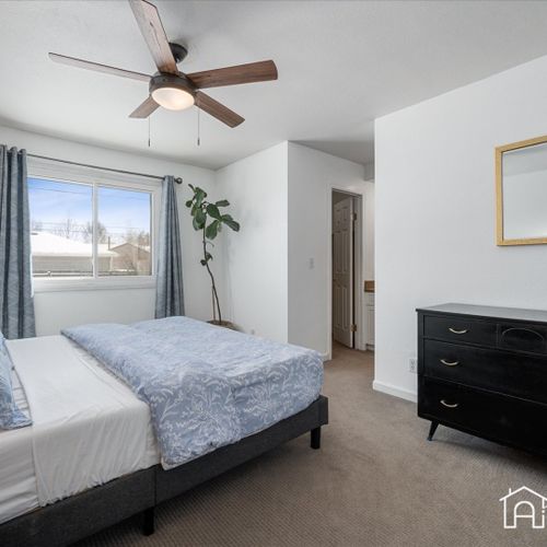 Experience the grandeur of the stylishly decorated upstairs master bedroom, featuring a spacious king size bed and elegant furnishings.
