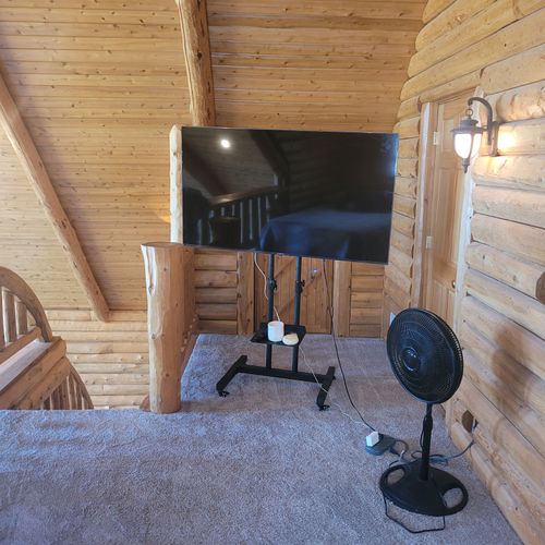 Loft:  the loft's tv and portable fan for cooling off