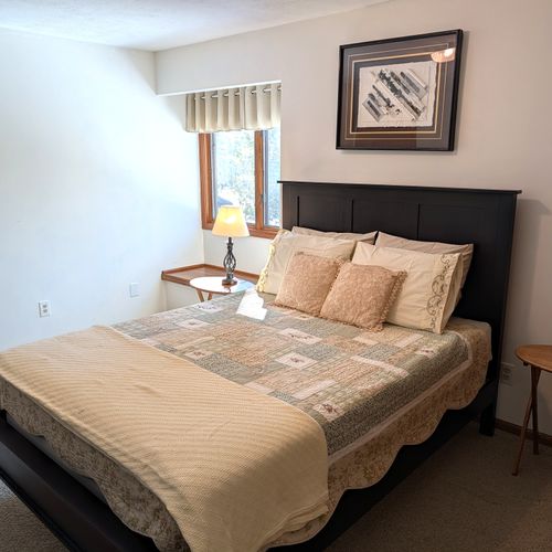 BEDROOM #4:  Features a queen-size, two dressers, a closet, nightstands, a lamp and private entrance to the second floor "jack and jill bathroom".