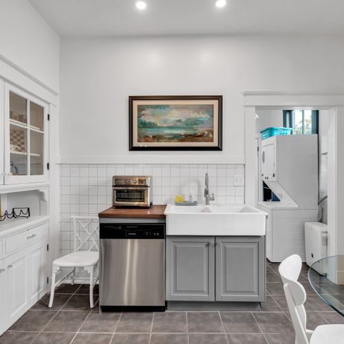Charming bathroom vignette w/ curated décor & warm accents.