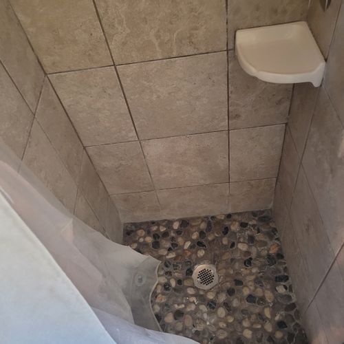 Bathroom:  full bathroom with a walk-in shower. Note that the shower is quite small (25" x 27") and may be difficult to use for larger individuals.