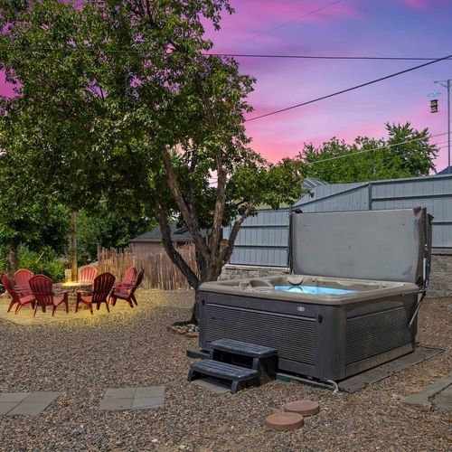 Enjoy the sunset glow while soaking in your private hot tub escape.