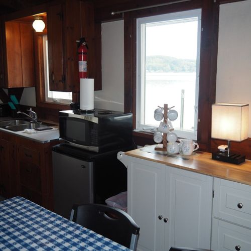 Kitchen:  the cottage has a small kitchen with all appliances except for a dishwasher. It does include a separate beverage cooler as well as a good supply of cooking and dining utensils.