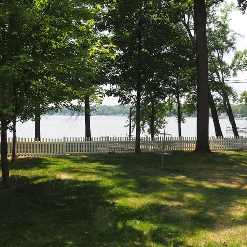 Exterior:  the large and fully fenced-in front yard, which includes a great view of the lake as well as a little disc golf course.